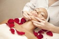 Spa salon: Young Beautiful Woman Having Facial Massage Royalty Free Stock Photo