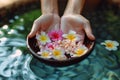 Spa serenity Female hand and flower in a serene water setting