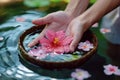 Spa serenity Female hand and flower in a serene water setting