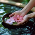 Spa serenity Female hand and flower in a serene water setting
