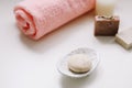 Spa set. Bar of handmade soap, candle and towel. Accessories for personal hygiene. Decor for bathroom interior Royalty Free Stock Photo