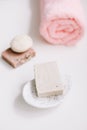 Spa set. Bar of handmade soap, candle and towel. Accessories for personal hygiene. Decor for bathroom interior Royalty Free Stock Photo