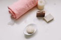 Spa set. Bar of handmade soap, candle and towel. Accessories for personal hygiene. Decor for bathroom interior Royalty Free Stock Photo