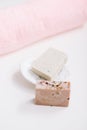 Spa set. Bar of handmade soap, candle and towel. Accessories for personal hygiene. Decor for bathroom interior Royalty Free Stock Photo