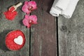 Spa set with bath salt, orchid flowers and towels on a wooden background Royalty Free Stock Photo