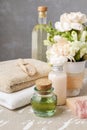 Spa set: bottle of essential oil, soft towels, bar of soap Royalty Free Stock Photo