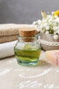 Spa set: bottle of essential oil, soft towels, bar of soap Royalty Free Stock Photo