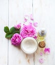 Spa Set. Massage oil, pot of moisturizing face cream and lotion flower top view Flat lay Royalty Free Stock Photo