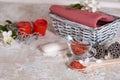 Spa set: scented candle, sea salt, liquid soap and romantic red roses Royalty Free Stock Photo