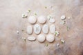 Spa setting for body care and relaxation with flowers on stone background top view. Flat lay.