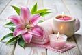 Spa Setting with Candle and Pink Lily Royalty Free Stock Photo