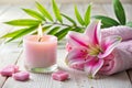 Spa Setting with Candle and Pink Lily Royalty Free Stock Photo