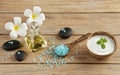 Spa setting concept with oil bottle, blue salt sea in spoon, min Royalty Free Stock Photo