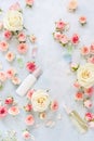 Spa setting with flowers, rose moisturizing cream and essential oil Royalty Free Stock Photo