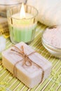 Spa setting with natural soap, bath salts and candle. Royalty Free Stock Photo