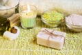 Spa setting with natural soap, olive oil, bath salts and candle. Royalty Free Stock Photo