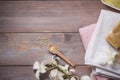 Spa setting with orchid, spoon,towel, soap, salt stones on old w Royalty Free Stock Photo