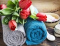 Spa Setting with Red Tulips and Soft Cotton Towels Royalty Free Stock Photo