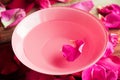 Spa setting with rose pink flowers and petals,bath salt and body Royalty Free Stock Photo