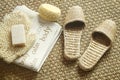 Spa setting with slippers, towel and soap Royalty Free Stock Photo