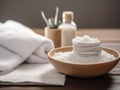 spa setting with a stack of white towels and a small dish of salt Royalty Free Stock Photo
