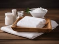 spa setting with a stack of white towels and a small dish of salt Royalty Free Stock Photo