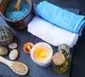 Spa setting still life with cotton towels, bath oil and salt, bu Royalty Free Stock Photo