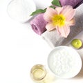 Spa setting of towel, flower, coffee on white. Copy space. Relax. Royalty Free Stock Photo