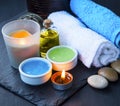 Spa setting with towels,face mask, bath salt and oil and candle Royalty Free Stock Photo