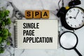 SPA Single Page Application text with alarm clock and magnifying glass on marble background Royalty Free Stock Photo
