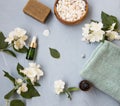 Spa and skincare flatlay setting with jasmine oil and flowers Royalty Free Stock Photo