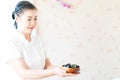 Spa staff holding hot stones for spa treatment Royalty Free Stock Photo