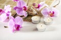 Spa still life with aromatic candles, orchid flower Royalty Free Stock Photo