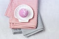 SPA Still Life Background Pink Bath Bomb on White Plate in Shape of Shell Pink and Gray Towels Spa Beauty Concept Top View Royalty Free Stock Photo