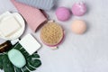 SPA Still Life Background Pink and Light Orange Bath Bombs Soaps Cosmetic Oil on Light Gray Background Washing Brush Gray and Pink Royalty Free Stock Photo