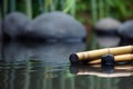 Spa still life with bamboo and zen stones with water surface. Generative AI Royalty Free Stock Photo