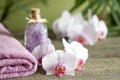 Spa still life with bath salt towel and orchids on wooden boards Royalty Free Stock Photo