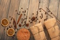 Spa still life, beauty and skin care. Coffee grains and spices with massage oil and towels, with space for designer Royalty Free Stock Photo