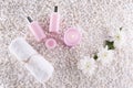 Spa. Still life. Candle, bottles with cream of pink color, Royalty Free Stock Photo