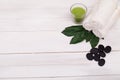 Spa still life with lavender oil, white towel and perfumed candle on natural wood Royalty Free Stock Photo