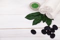 Spa still life with lavender oil, white towel and perfumed candle on natural wood Royalty Free Stock Photo