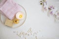 Spa still life with orchid flower, towels, bath salt, candle,oil and soap, top view of natural spa products Royalty Free Stock Photo