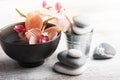 Spa still life with pebbles and red orange orchid Royalty Free Stock Photo