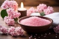 Spa still life with pink bath salt, flowers and candles on wooden background, Concept of spa treatment with pink salt, AI