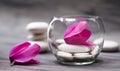 Spa still life with pink orchid, white zen stone and tea candle Royalty Free Stock Photo