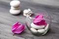 Spa still life with pink orchid, white zen stone and tea candle Royalty Free Stock Photo