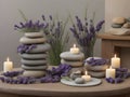 Spa still life with stack of stones, candles and lavender flowers Royalty Free Stock Photo