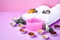 Spa still life treatment with candles, stones, sea shells starfish and towels on pink background, skincare products, natural Royalty Free Stock Photo