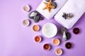 Spa still life treatment with candles, stones, sea shells starfish and towels on pink background, skincare products, natural Royalty Free Stock Photo