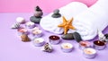 Spa still life treatment with candles, stones, sea shells starfish and towels on pink background Royalty Free Stock Photo